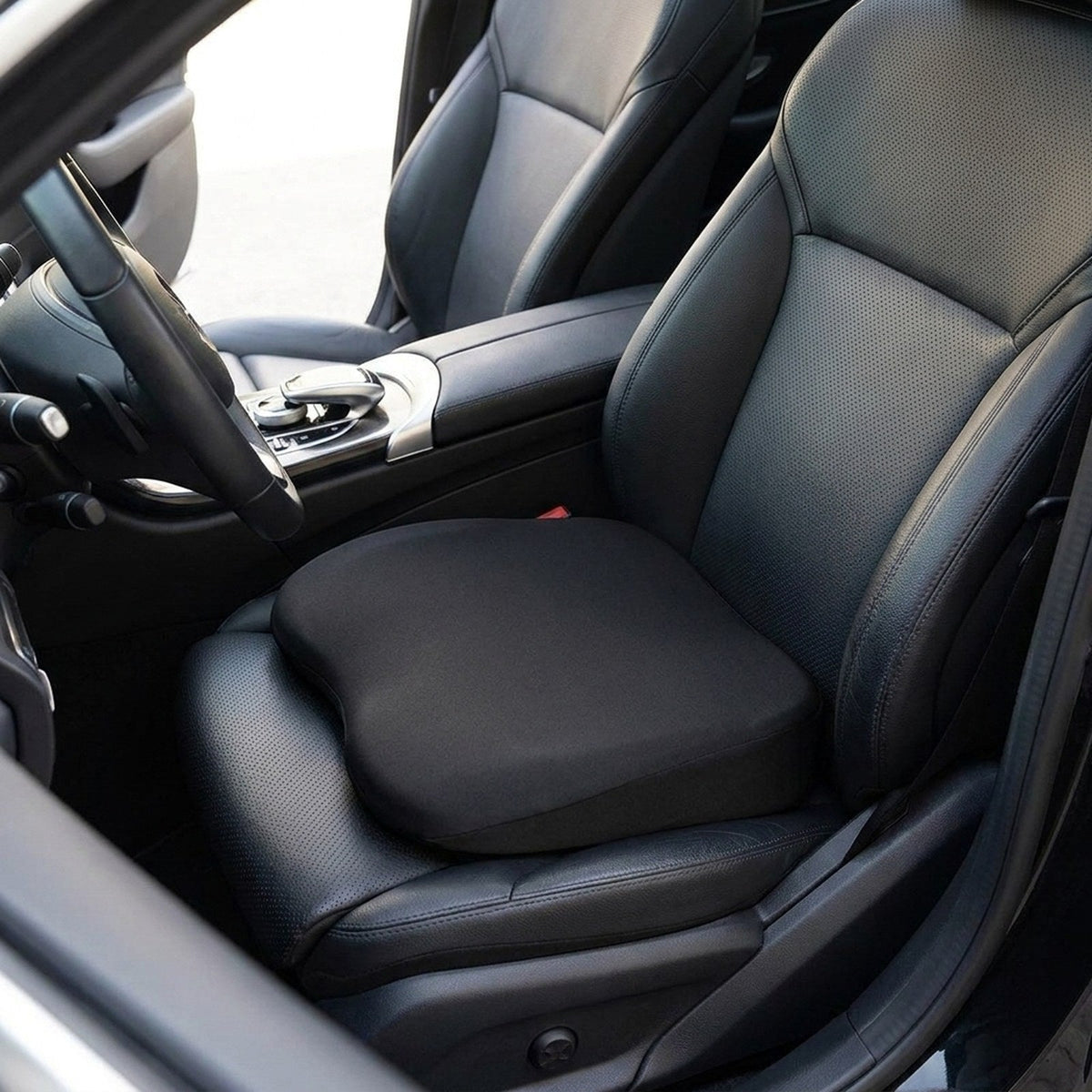 Black RideRise seat booster cushion on the driver's seat of a car