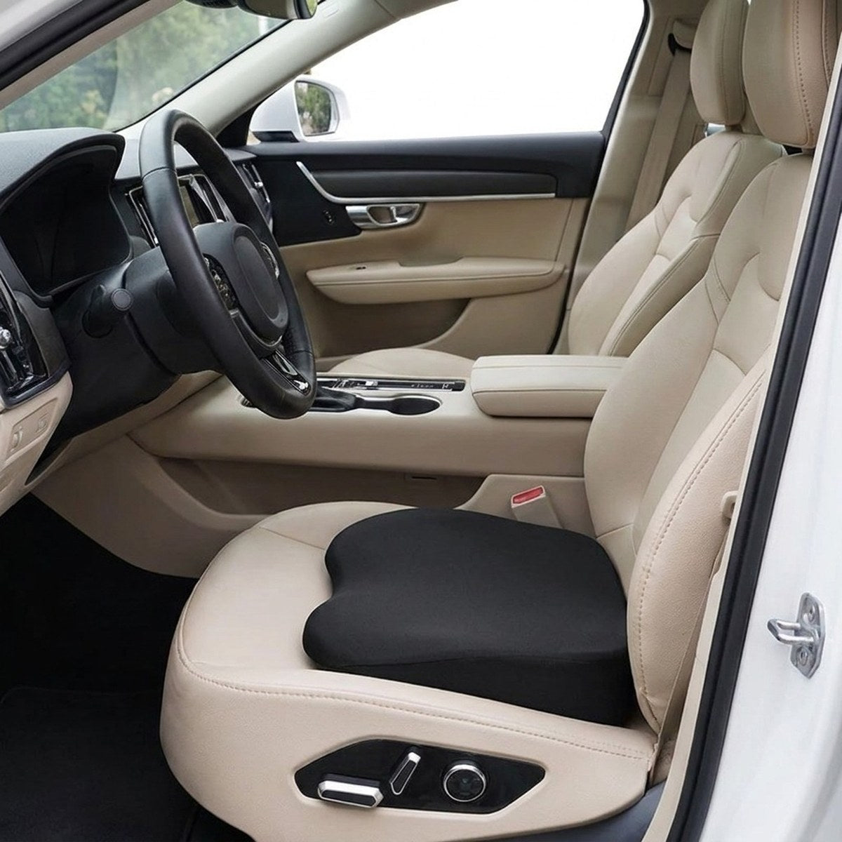 Black RideRise booster cushion on a car's driver seat