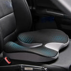 ErgoDrive inclined seat cushion with black top and gray sides on a black leather car seat