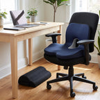 Navy Chair-Fit seat-and-back cushion on a black office chair with the black mesh footrest under the desk