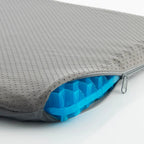 Close-up of the zipper and the blue honeycomb structure inside the gray cover
