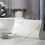 ZenSleep contour pillow with bamboo-leaf print cover in a bedroom setting