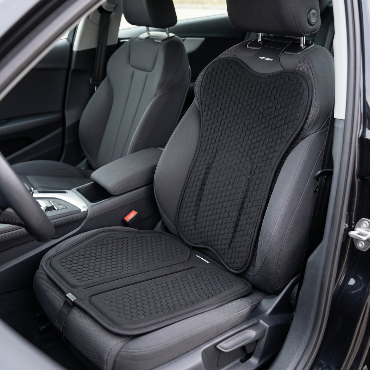 Black EaseDrive seat pad and back cushion set on a dark car seat