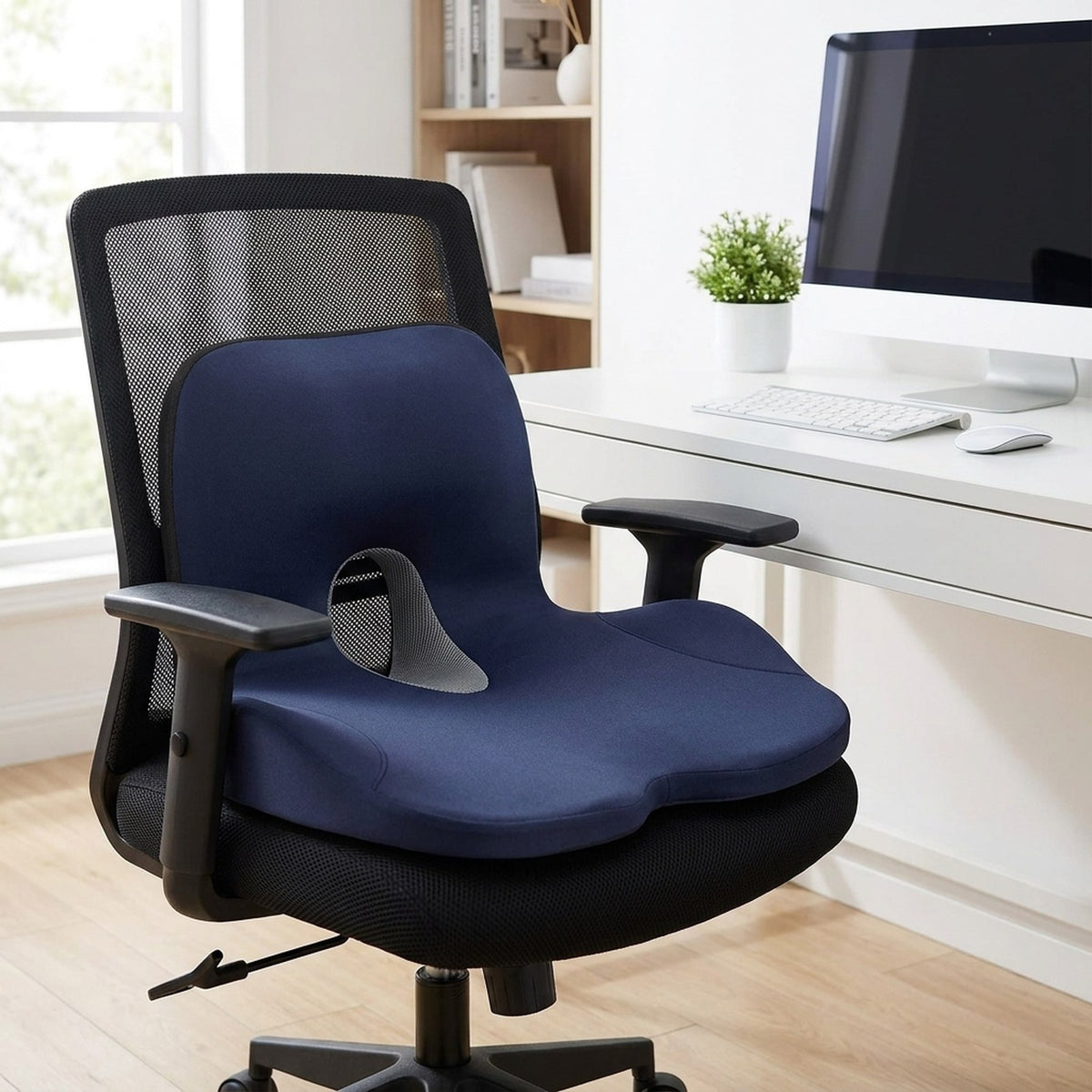 Navy ErgoWrap one-piece seat and back cushion on a black mesh office chair