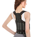 Back view of a woman wearing the black FlexBrace posture corrector with crossed shoulder straps and waist belt