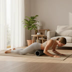 Woman using the FasciaFlow roller under her hips on a floor mat