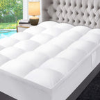 Close-up of the box-quilted surface of the CloudQuilt mattress topper on a bed
