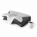 CerviZen contour pillow shown beside a coffee mug