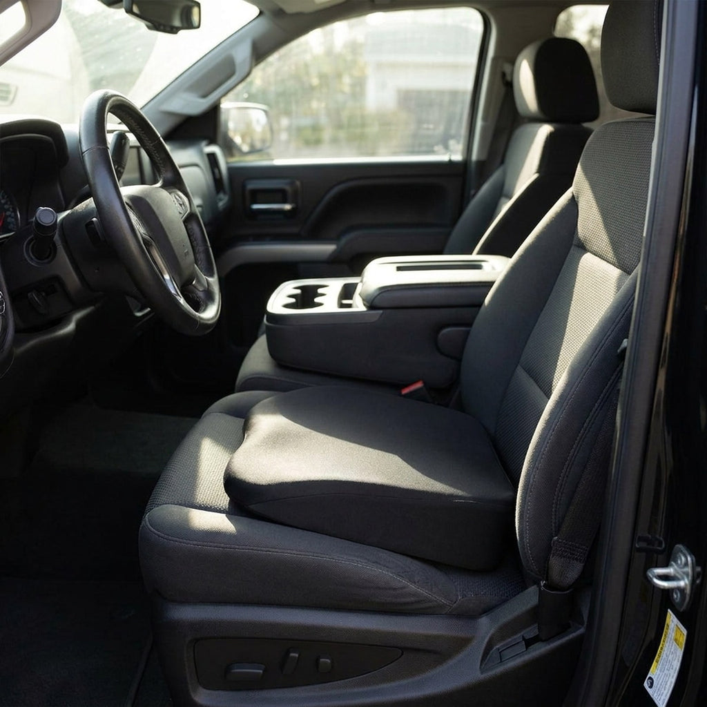Black RideRise booster cushion on the driver's seat of a pickup truck