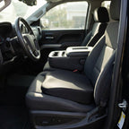 Black RideRise booster cushion on the driver's seat of a pickup truck