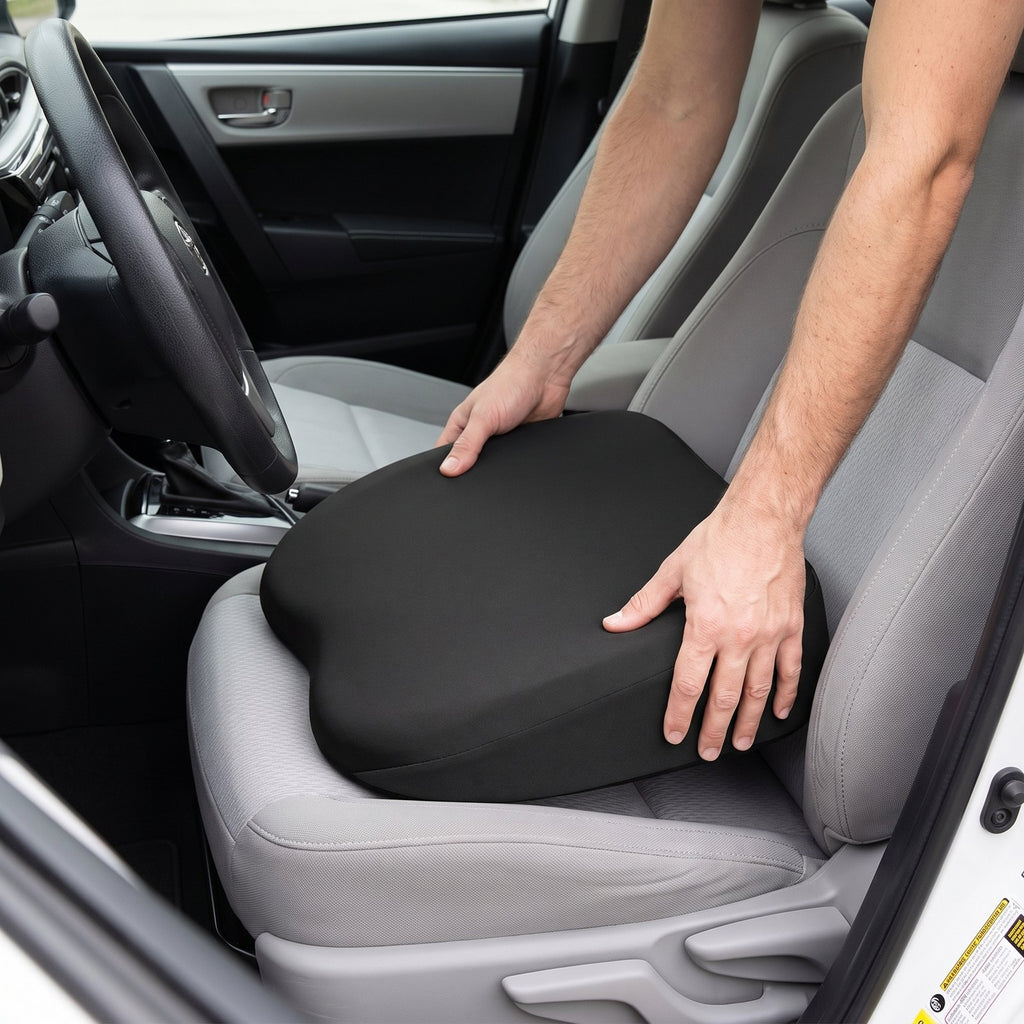 Placing the black RideRise cushion on the driver's seat, thick end against the backrest
