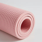 Close-up of the rolled CoreFlow mat showing the grooved non-slip texture and foam thickness