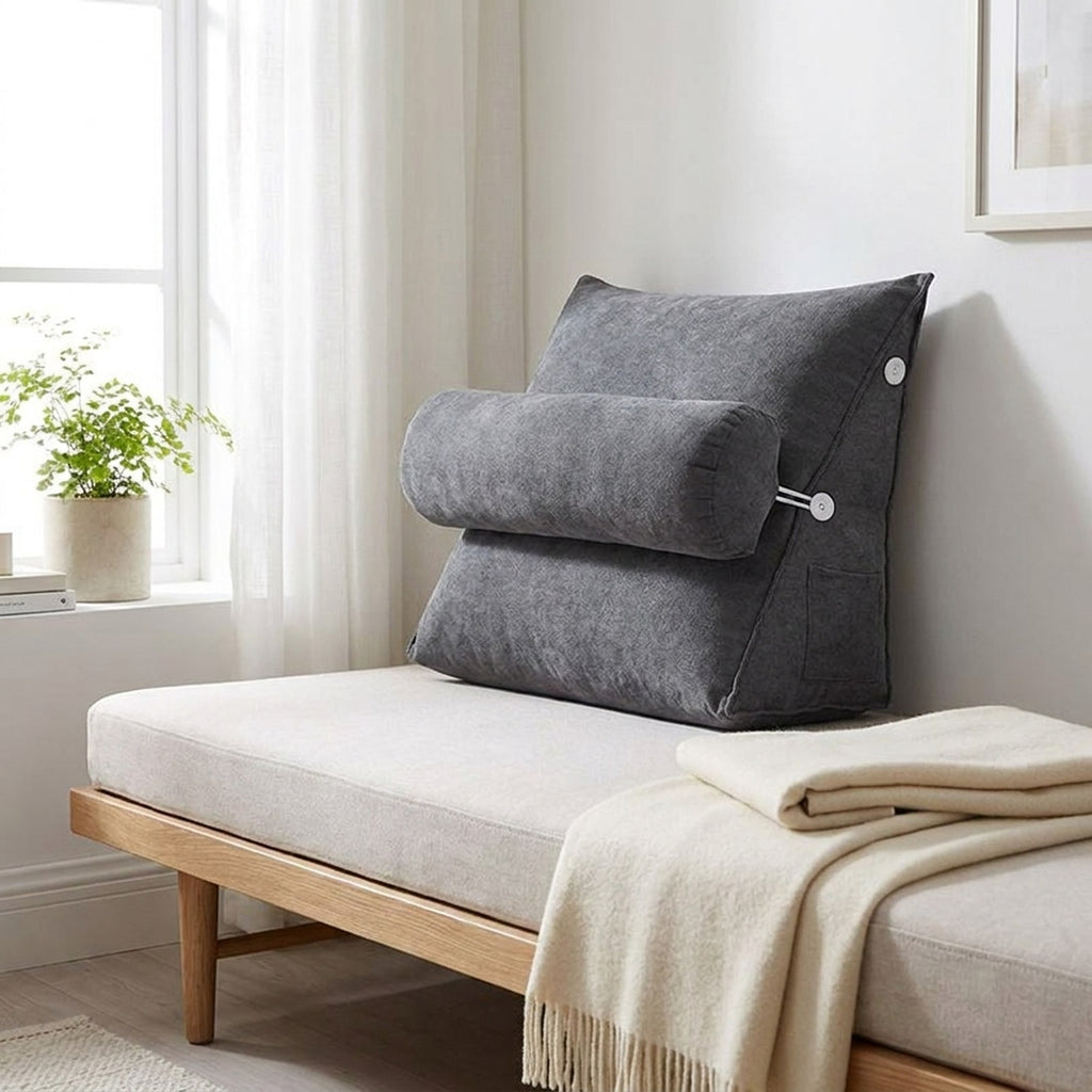 Gray WedgeRest backrest pillow on a daybed by a window